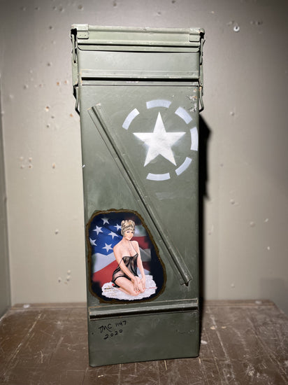 Vietnam ammo cannister with pin-up art