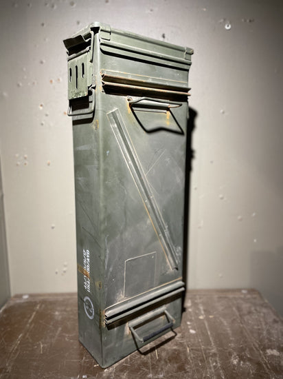 Vietnam ammo cannister with pin-up art